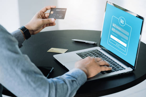istock Online Shopping and Internet Payments, Asian man are using their credit card and computer laptop to shop online or conduct errands in the digital world. 1376369354