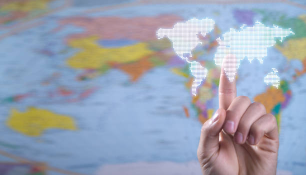 istock Male hand touching in world map. 1376404729