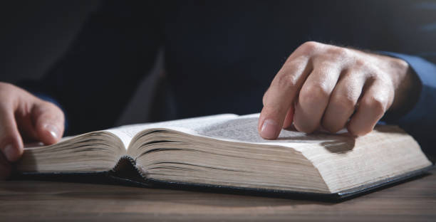 istock Caucasian man reading the Holy Bible. 1376404778