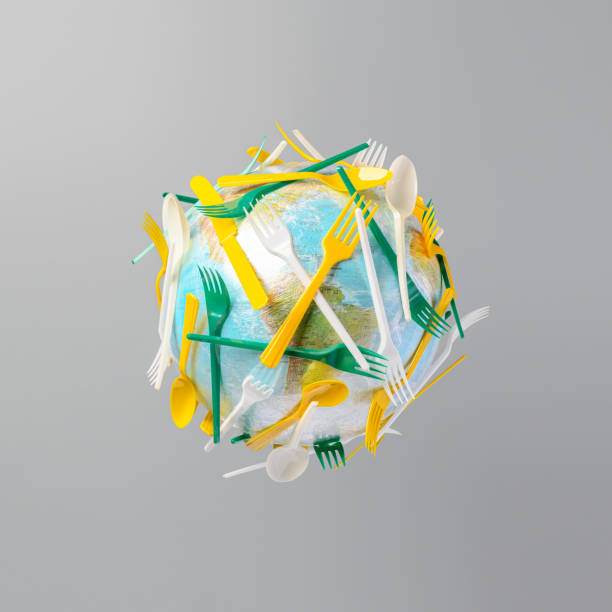 istock World globe is fully covered with disposable plastic knives, spoons, and forks. Levitating in air over gray background. The concept of pollution of the planet Earth with disposable plastic. 1376404887