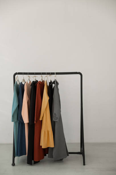 istock Black minimalistic rack with eco linen clothes on white backgrou 1376405194