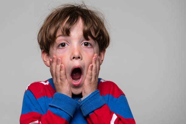 istock Surprised little boy looking at the camera 1376407287