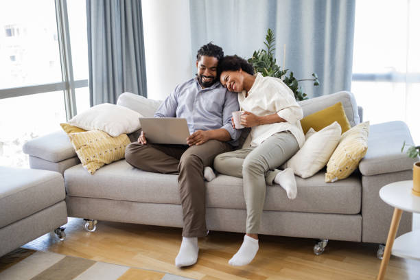 istock Woman leaning on man. They are using laptop. 1376494109