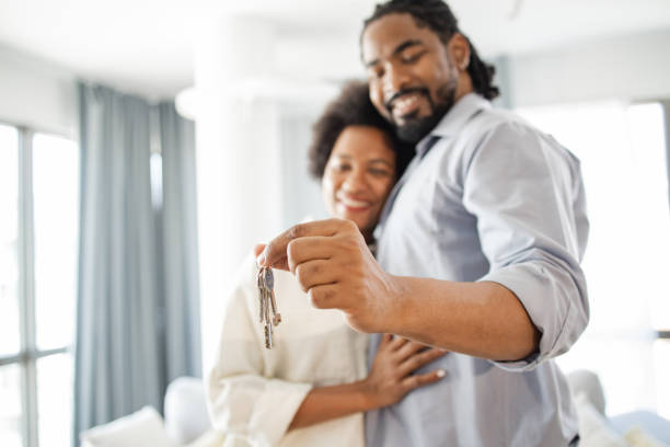 istock Happy married couple celebrating their first house purchase 1376495738