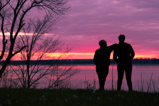 Friends in nature with sunset sky