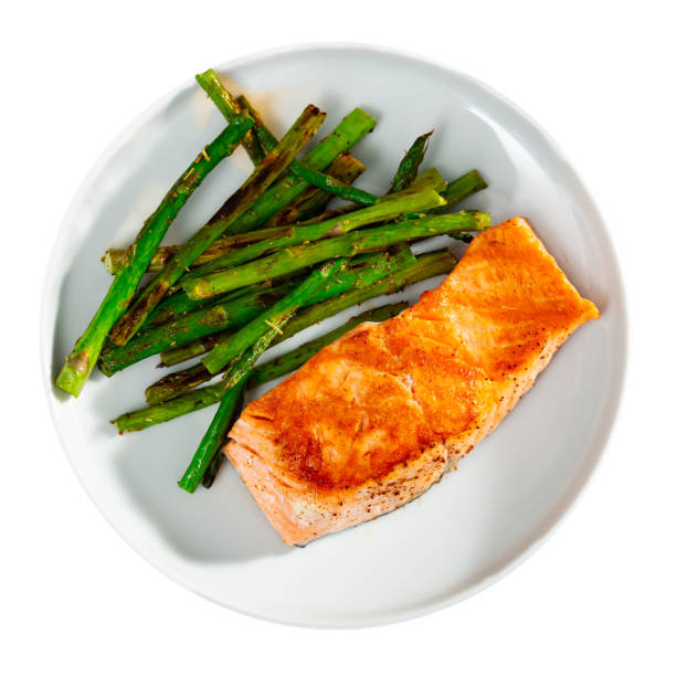istock Roasted salmon steak and green asparagus on plate 1376516981