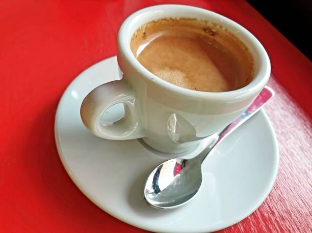 istock White cup of Espresso on red table 1376518096