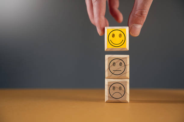 istock man holding wooden cubes with face emotion 1376521532