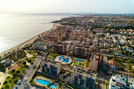 Aerial view beach and townscape of Mil Palmeras. Costa Blanca, Province of Alicante. Spain