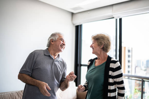 istock Happy senior couple dancing at home 1376528058