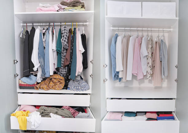 Before untidy and after tidy wardrobe. closet and nicely arranged clothes in piles and boxes after the revision and organization. Messy clothes thrown on a shelf and nicely arranged clothes in piles stock photo