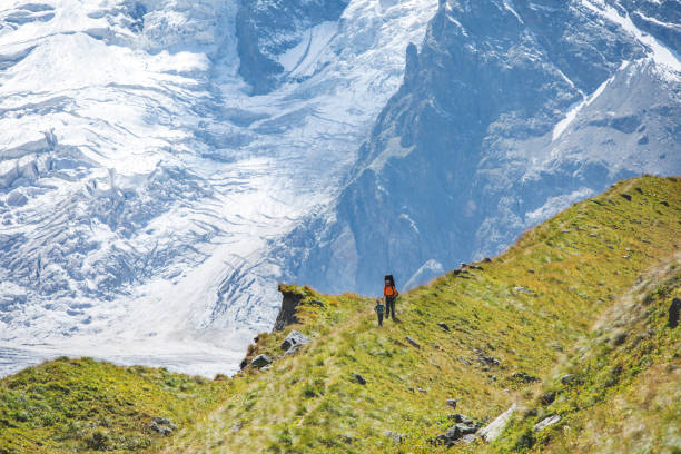 istock Father and son trekking in mountains 1376529605