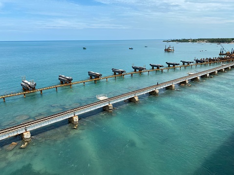 Pamban Bridge with green sea water background