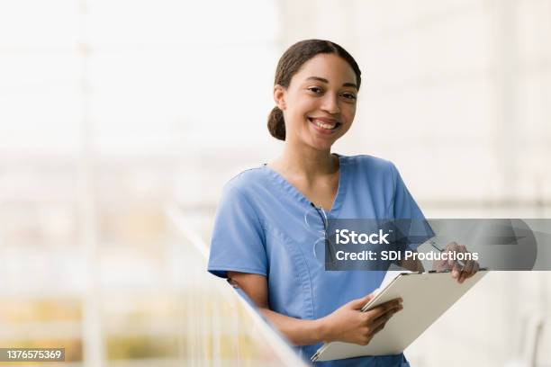 Female Medical Student Smiles For Camera Before Class Stock Photo - Download Image Now