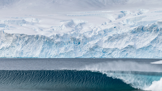 Large ice towers can collapse from the face of a glacier causing large powerful waves to form.