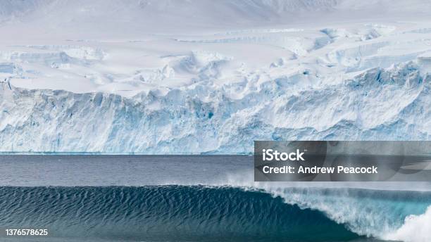 A Large Breaking Wave Formed From A Glacial Calving Event In Neko Harbor Antarctic Peninsula Stock Photo - Download Image Now