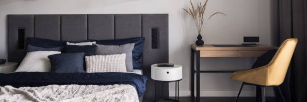istock Stylish bedroom with desk, panorama 1376585648