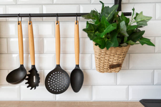 istock kitchen ladles and appliances hang on a brick wall. kitchen utensils 1376596161