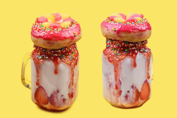 istock Freakshake. Extreme milkshake with strawberry, jelly sweets, donut. 1376597784