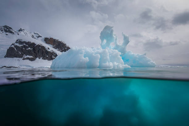 istock Under and over water view of an iceberg. 1376601541