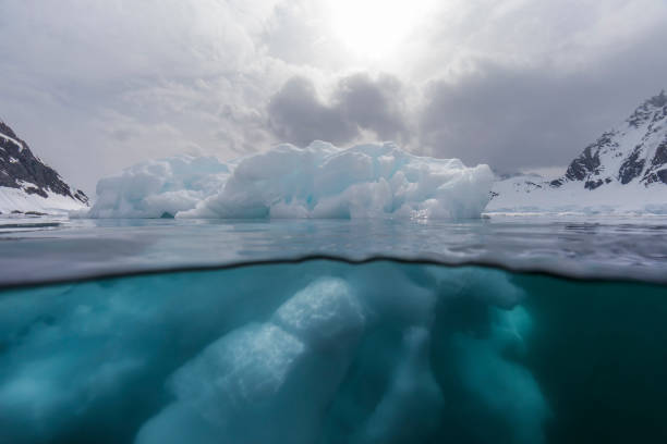 istock Under and over water view of an iceberg. 1376601543