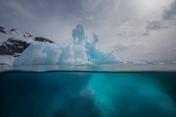 istock Under and over water view of an iceberg. 1376602605