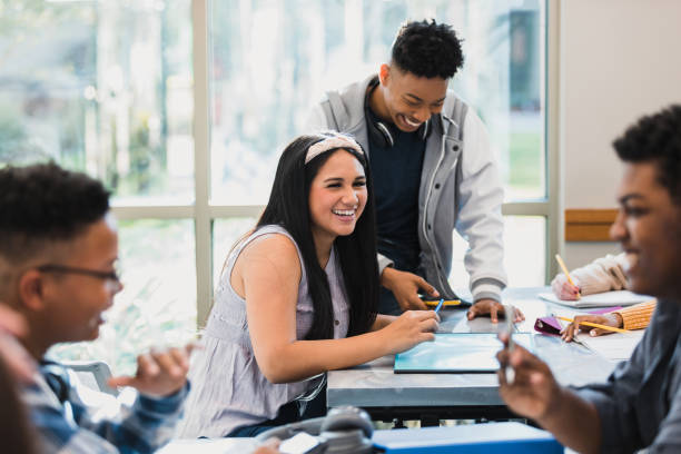 istock Diverse teens enjoy working together in groups 1376611826