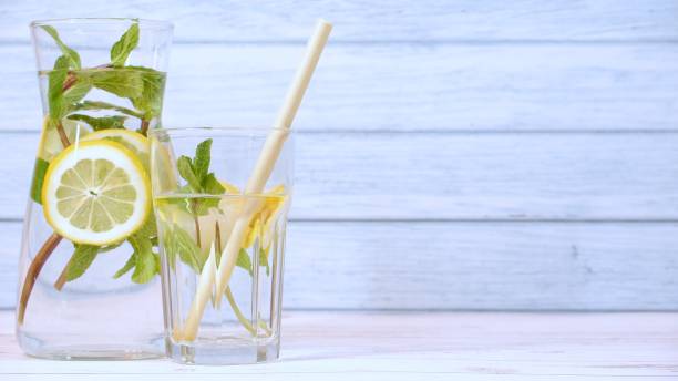 istock Refreshing lemon water with mint in a glass carafe 1376615356