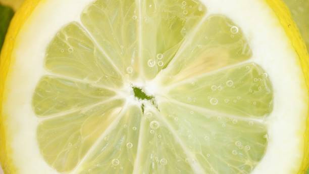 istock Close up of lemon slice in water 1376616350