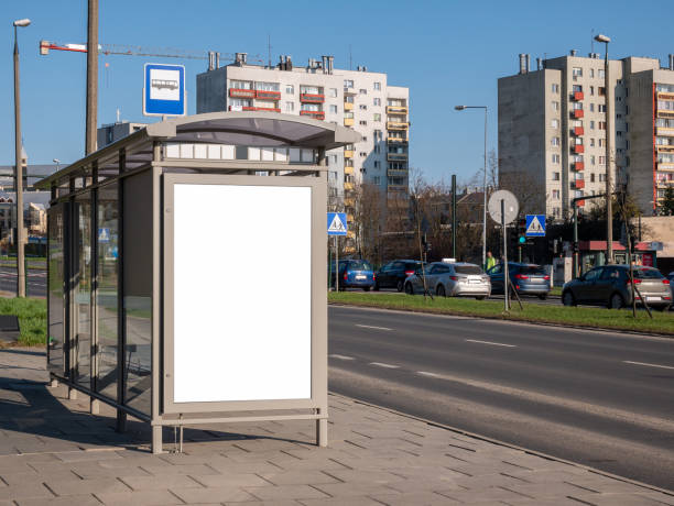 istock Empty blank white cut out bus stop advertisement poster, vertical ad banner sign board, city advert on the street, urban public space advertising placeholder simple template, daytime, nobody 1376653243