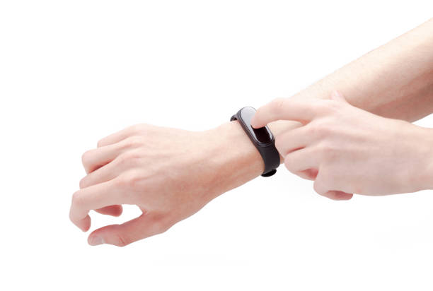 istock Anonymous man tapping a blank empty screen of a modern smartwatch with a finger, smart fit band hands gestures, hands isolated on white, cut out. Tech wearables, wearable technology simple concept 1376655963