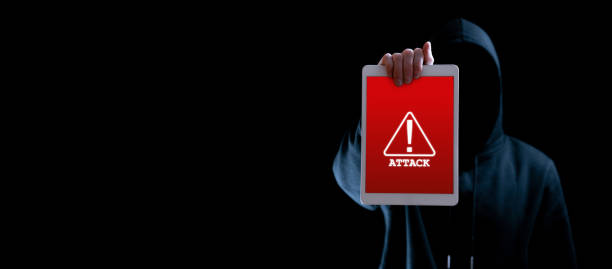 istock Hacker attack tablet cyber security. Digital mobile phone in hacker man hand isolated on black. Internet web hack technology. Login and password, cybersecurity banner concept. 1376687136