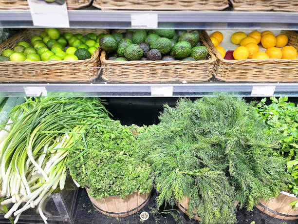 dill, parsley, onion on the supermarket counter