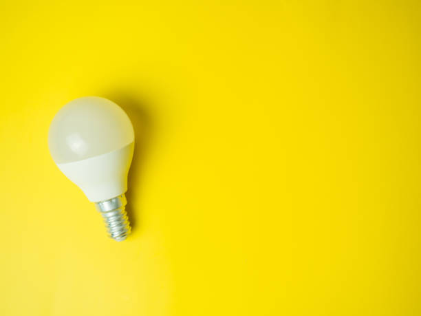 istock LED light bulbs on yellow background. Energy saving and environmentally friendly light bulbs. 1376701915