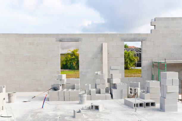 Foundation and brick wall at a construction site stock photo