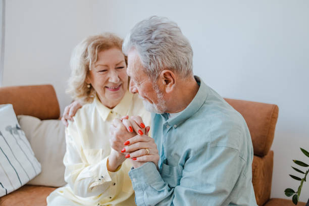 istock Senior couple is embracing at home 1376716619