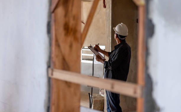 Construction worker supervising the development of a construction site stock photo