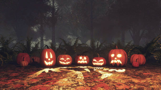 istock Scary halloween pumpkins in misty forest at dusk 1376810044