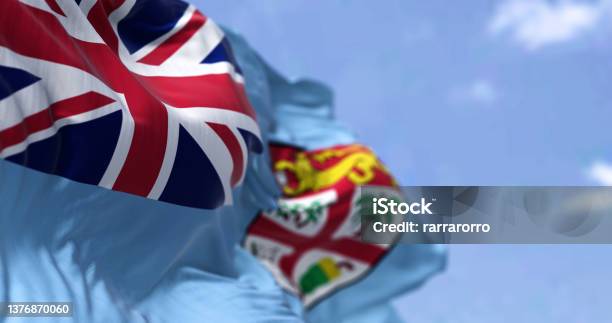 Detail Of The National Flag Of Fiji Waving In The Wind On A Clear Day Stock Photo - Download Image Now