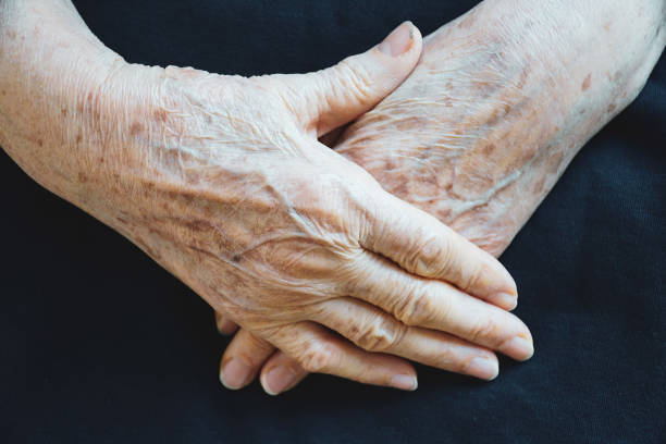 Old woman hands holding together. Old woman hands holding together. International day of older persons idea concept. Hands of the old person. Old woman holding hands together. Close up of old wrinkled hands. aging population stock pictures, royalty-free photos & images