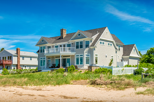 New house built on a beach in Barnstable, Cape Cod, Massachusetts, USA on a sunny day.