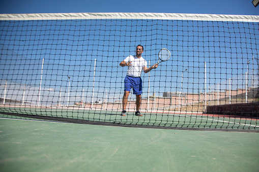 Man training tennis