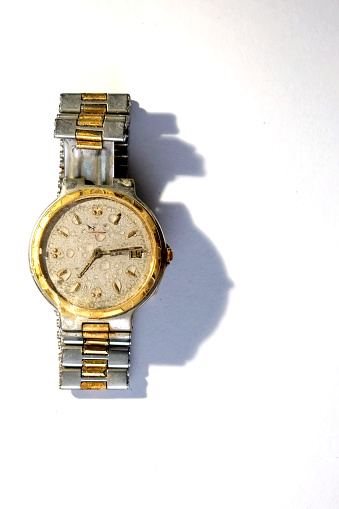 Gold plated dead watch with water inside