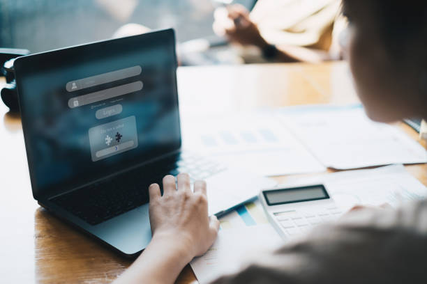 istock business women using information security and encryption for her saving account, business, technology and future Concept. 1377047275