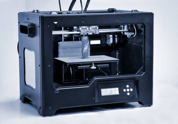 istock 3D printer works and creates an object from the hot molten plastic 1377048357