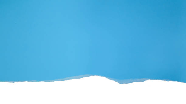 istock Torn blue paper on white background. Concept for presentation and education 1377049195