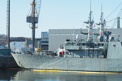 Moored modern supply and tanker warship Jacques Chevallier A-725 at French Navy Naval Base at City of Toulon on a cloudy late spring day. Photo taken June 9th, 2023, Toulon, France.