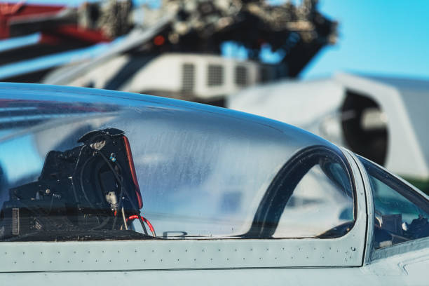 Norfolk, Virginia, USA - April 9, 2024: The sun shines on an aircrew going through their pre-check list before departing Norfolk International Airport.