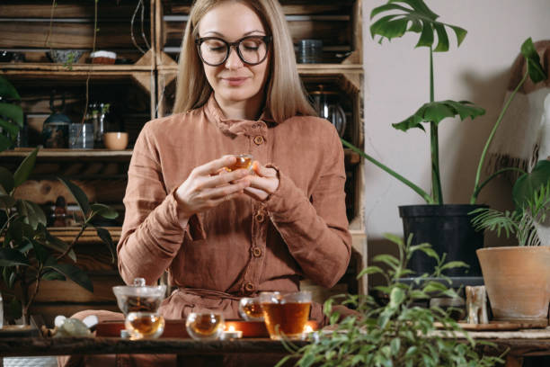 istock Women preparing tea ceremony in cafe in small cups 1377172457