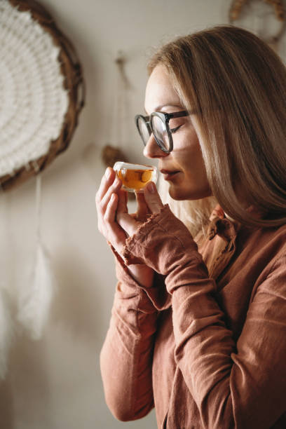 istock Women preparing tea ceremony in cafe in small cups 1377173528
